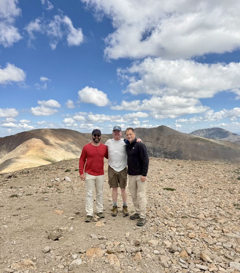 Three men on a summit ridge in the Mosquito Range